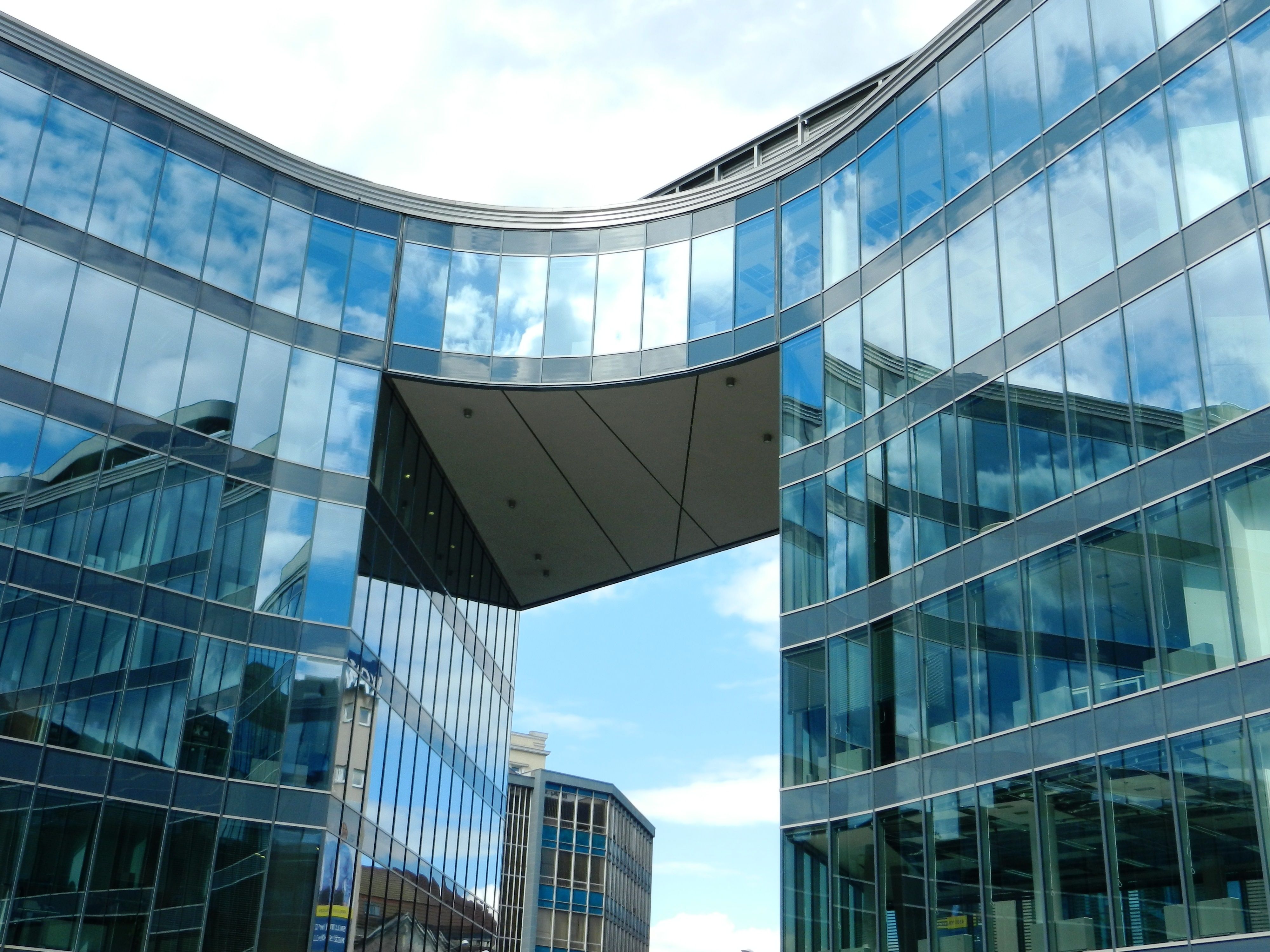 Bright curved glass office complex in a professional business district